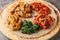 Ethiopian Injera flat bread with various vegetable and meat fillings close up on the wooden board. Horizontal