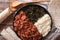 Ethiopian kitfo: marinated beef with herbs and cheese close-up a