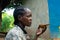 Ethiopian woman drinking coffee