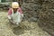 Ethiopian woman makes from cow dung fuel disks