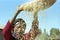 Ethiopian woman separate chaff from the grain