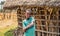 Ethiopian young boy in front of his home