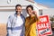 Ethnic couple holding new house keys