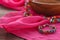 Ethnic gem bijouterie lay on pink silk shawl