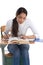 Ethnic Indian college student by desk in class