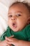 Ethnic multiethnic mulatto Baby boy in green