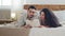 Ethnic spanish couple beautiful young brunette woman with curly hair and bearded handsome spaniard man lie together on