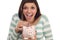 Ethnic Teen Putting Coin Into Piggy Bank on White