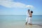 Ethnicity Happy asian and africans american couple enjoy relaxation resting on the beach