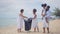 Ethnicity Happy asian and africans american Family picking up garbage activity on the beach