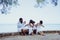 Ethnicity Happy Family Africans Enjoy relaxation resting on the beach summer vacation time