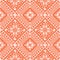 Ethnics geometric orange flower seamless in orange background for fabric