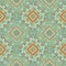 Ethnics pattern with geometric seamless flower in green background for fabric