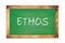 ETHOS text written on green school board