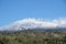 Etna with the smoking peak and spring slopes