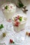 Eton mess, traditional English dessert with gooseberry, whipped cream and meringue on a light background. Rustic style.