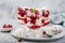 Eton mess, traditional english dessert, meringues, whipped cream, berry sauce and fresh raspberry in  glass