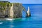 Etretat Aval cliff and rocks landmark and blue ocean . Normandy, France.