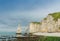 Etretat Aval cliff, rocks and natural arch landmark and blue ocean. Aerial view. Normandy, France, Europe