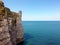 Etretat Cliffs , going on the calm blue sea, France.