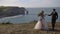 Etretat. France December 2016 Beautiful brides are photographed against the backdrop of nature. A young couple walks