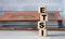 ETSI - word on wooden cubes on the background of a folder with documents