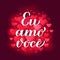 Eu Amo Voce calligraphy hand lettering on red blurred hearts background. I Love You in Brazilian Portuguese. Valentines
