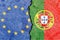 EU and Portugese flag on a cracked wall-politics, war, conflict concept