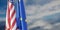 EU and USA and relationship. US America and European Union flags, cloudy sky