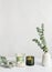 Eucalyptus branches bouquet in vase and Aromatic home perfume candles, vertical shot. Home Interior comfort element and