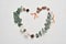 Eucalyptus leaves heart frame love on white background with cones, acorn and place for your text. Autumn wreath made of