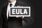 Eula sign is held by businessman