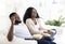 Euphoric teen couple watching tv at home