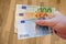 Euro bank-notes in white man hand. Pay bills with money. Currency concept. European currency