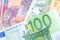 Euro banknote over a rainbow of international banknotes