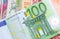 Euro banknote over a rainbow of international banknotes