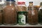 Euro banknotes in a glass jar among other jars with cereals and dried fruits. Keeping money in a glass jar.