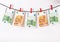 Euro banknotes hanging on a clothesline against white background. Euro money with red clothes pegs on rope. Money Laundering euro