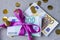 Euro banknotes on a stacks with violet bow. Gift, bonus or reward concept.