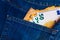 Euro bills in jeans pocket background. Euro banknotes in jeans back pocket. Concept of rich people, saving or spending money. Euro