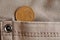 Euro coin with a denomination of 5 euro cents in the pocket of beige denim jeans