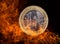 Euro coin with fire flames.