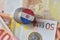 Euro coin with national flag of paraguay on the euro money banknotes background.