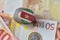 Euro coin with national flag of suriname on the euro money banknotes background.