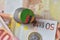 Euro coin with national flag of zambia on the euro money banknotes background.