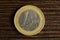 Euro coin on a wooden background. european money