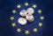 Euro coins on background of EU flag, the euro is official currency of 19 of the 28 member states of the EU, known as the eurozone