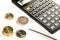 Euro coins, calculator and a pen