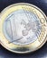 Euro coins. Focus is on inscription with name of Eurozone currency on 1 one euro coin. Closeup. News about economy and money of