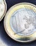 Euro coins. The focus is on the inscription with the name of the Eurozone currency on the one euro coin. Close-up. News about the